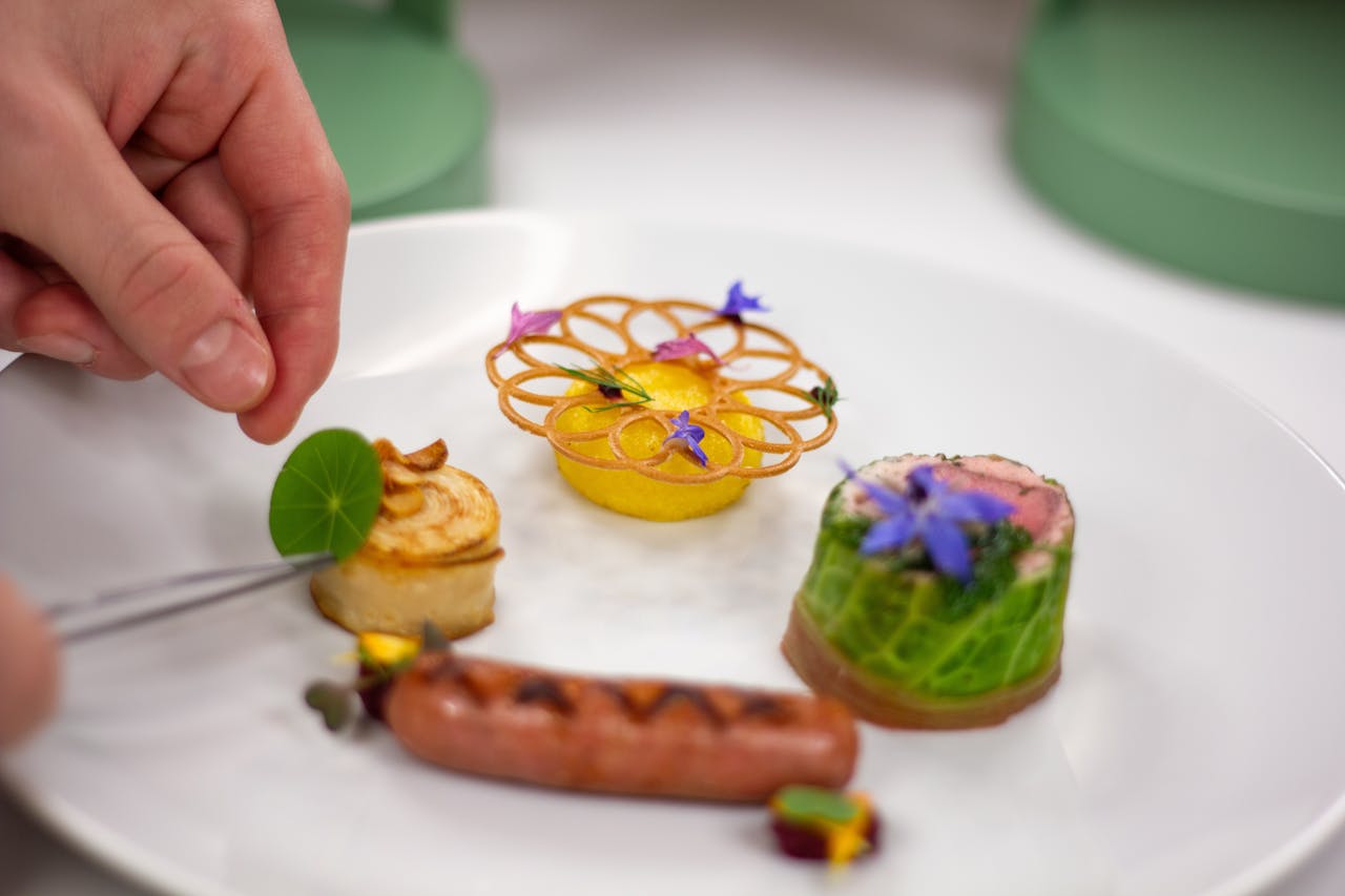 Exquisite culinary presentation with creative gourmet dishes on a white plate.